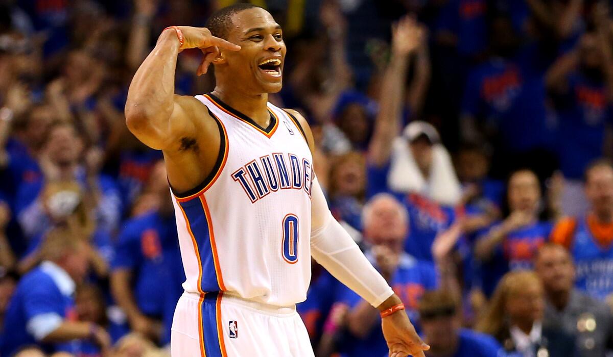 Thunder point guard Russell Westbrook celebrates after making a three-point shot against the Memphis Grizzlies on Saturday evening in Oklahoma City.