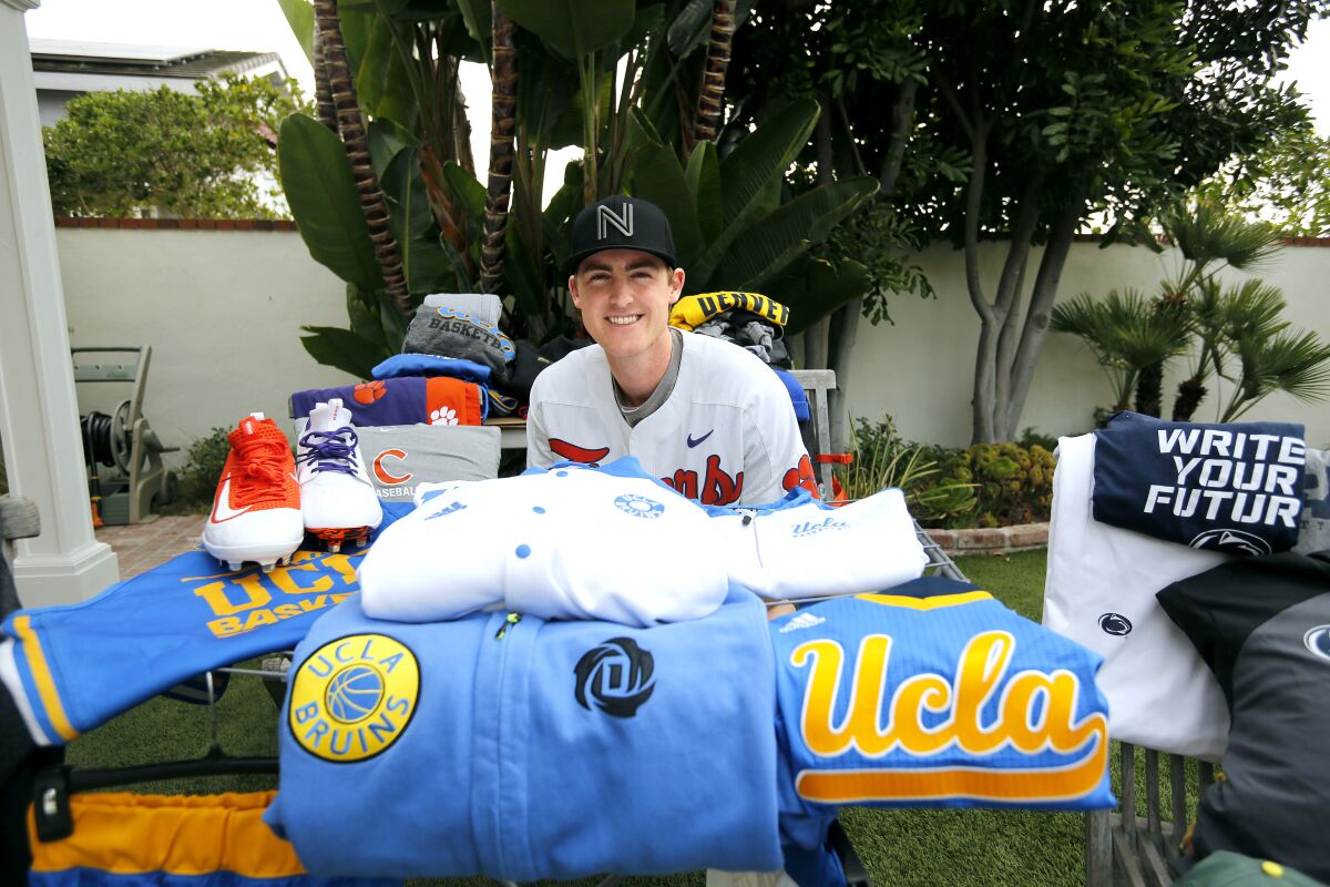 Patrick Cromwell, 25, shows some of the merchandise from a company he co-founded with a friend on Saturday. 