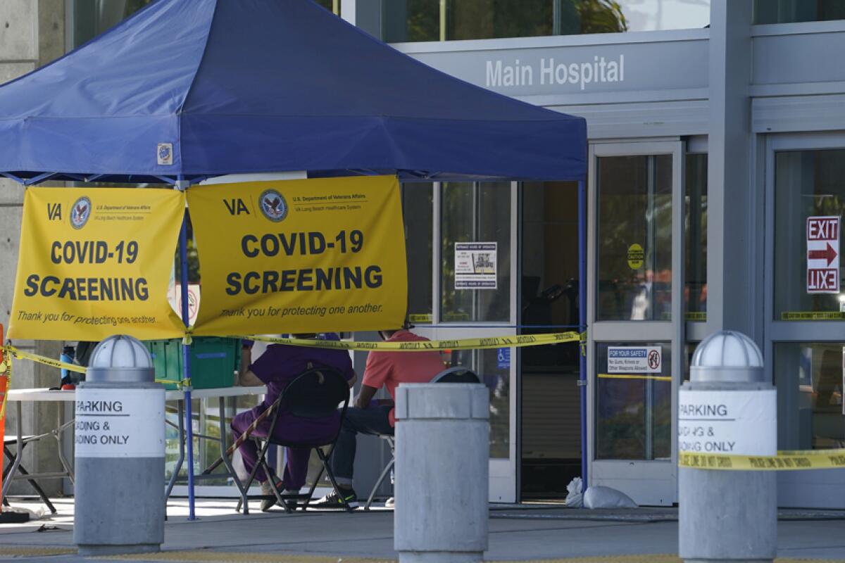 This file photo shows a COVID-19 screening site outside the VA Long Beach Healthcare System.