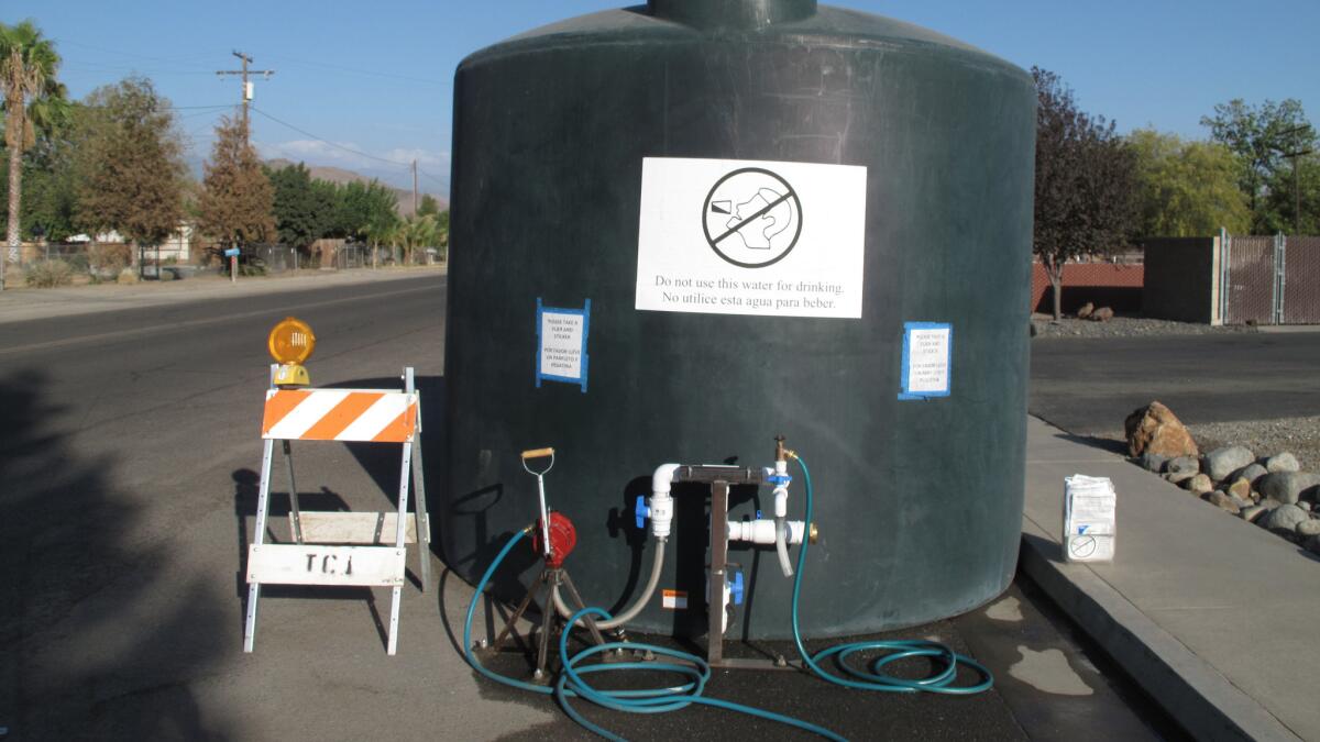 A 5,000-gallon water tank, which residents whose wells have run dry can draw water from, in East Porterville, Calif.