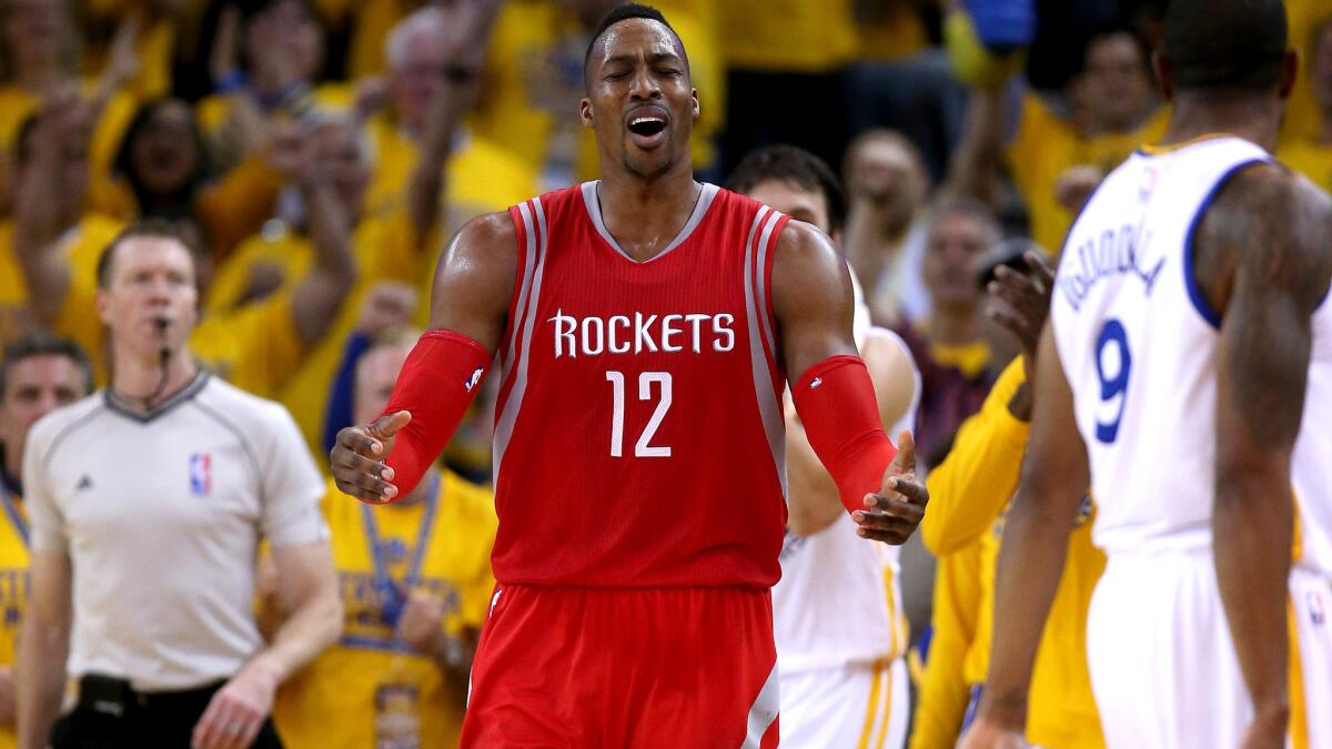 Rockets center Dwight Howard reacts after getting called for a foul in the second half of Game 5 against the Warriors on May 27.