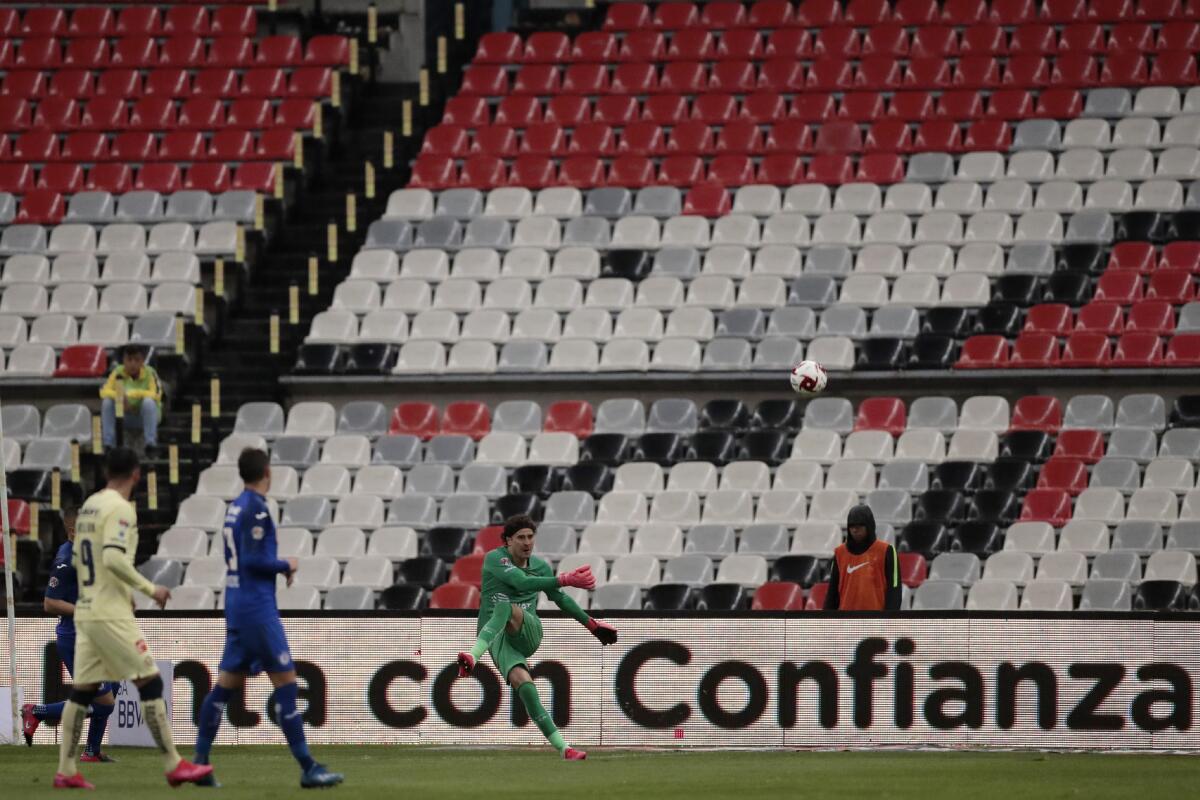 America's goalkeeper Guillermo Ochoa kicks the ball during a Mexican soccer league match against Cruz Azul on Sunday in a match played without fans.