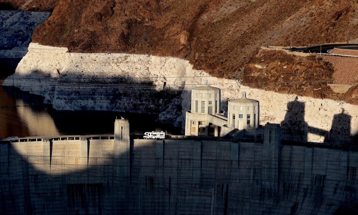 A white "bathtub ring" behind the Hoover Dam shows the low water level at Lake Mead on June 11. 