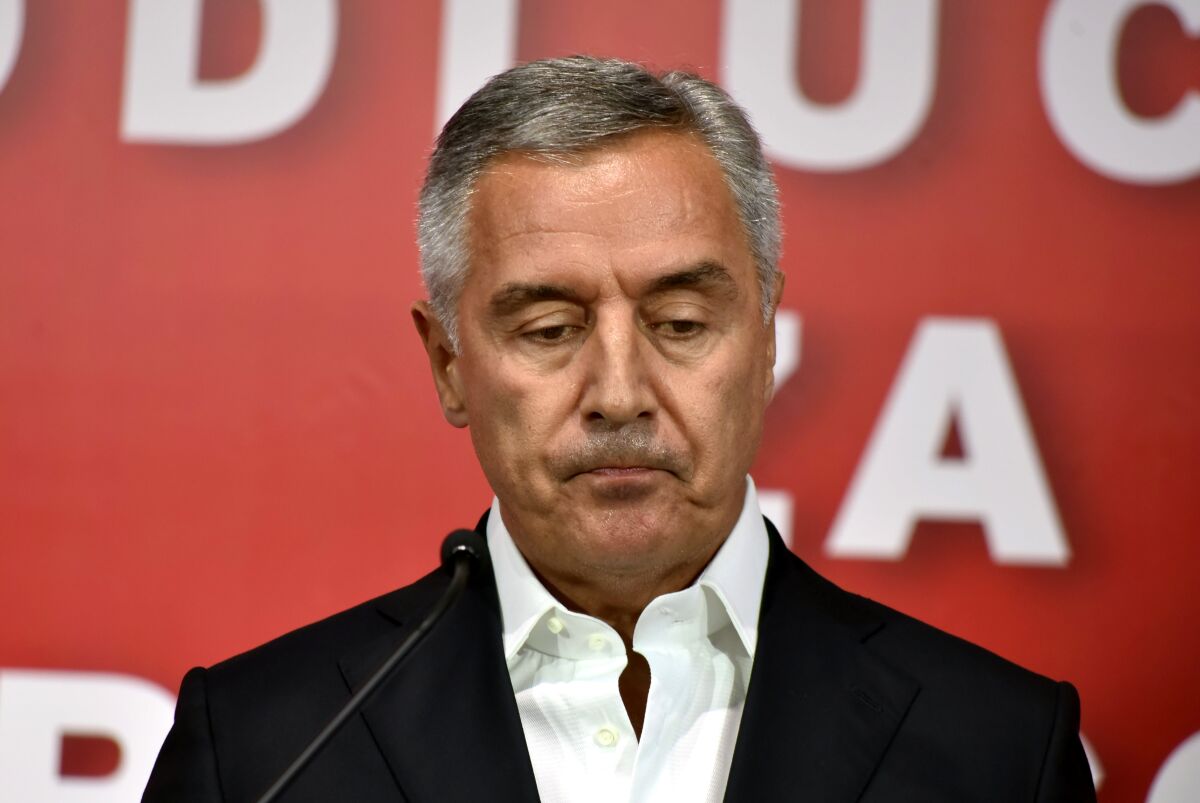 Montenegrin President Milo Djukanovic speaks in his DPS party headquarters in Podgorica, Montenegro, early Monday, Aug. 31, 2020. Montenegro's pro-Serb and Russian opposition groups claimed victory against the ruling pro-Western party in a tense parliamentary election that could see a change in the course of the small Balkan state. (AP Photo/Risto Bozovic)