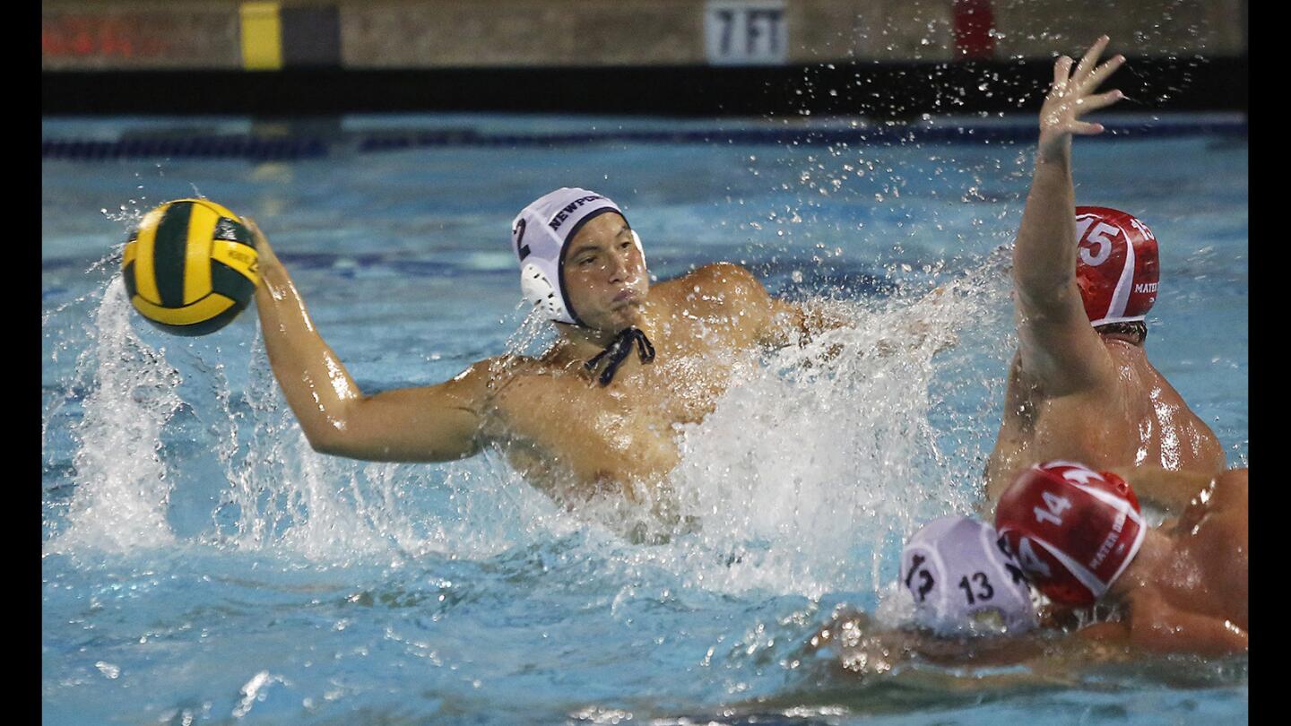 Newport's Makoto Kenney winds-up to take a shot in division-1 boys water polo semi-final against Mater Dei on Wednesday.