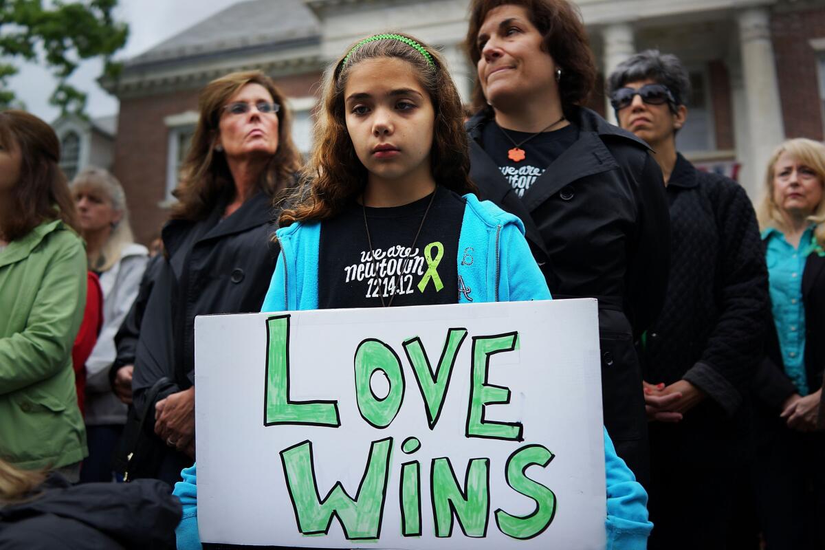 Cecilia Floros, 10, of Newtown, Conn., attends a remembrance event on the six-month anniversary of the massacre at Sandy Hook Elementary School last month.