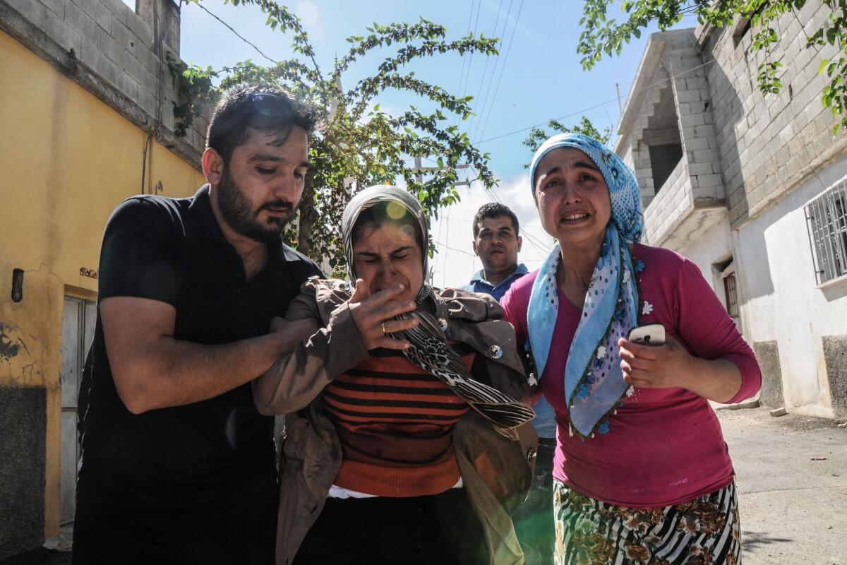 Residents flee as rockets fired from Syria land in Kilis on April 19.
