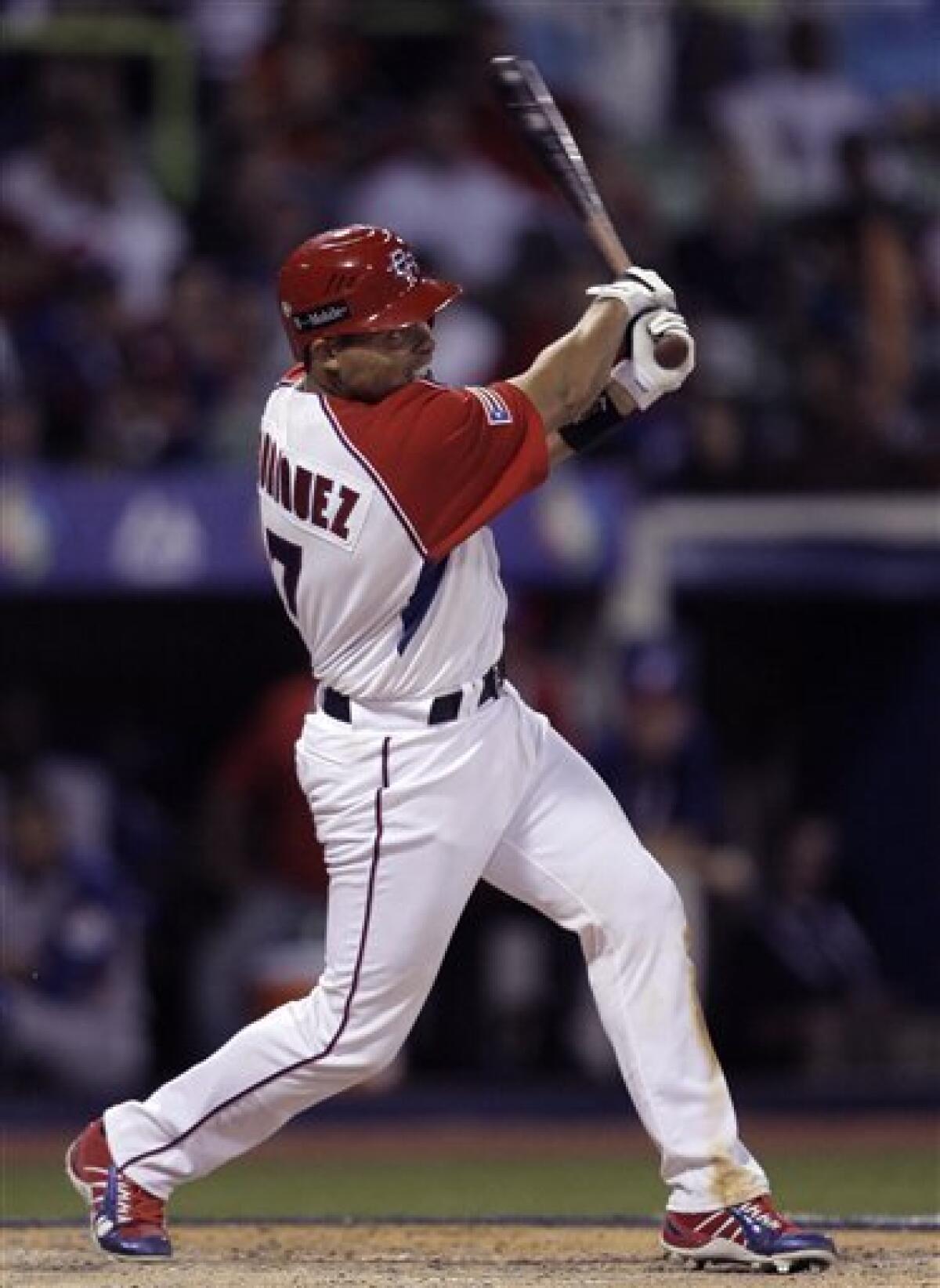 Team Puerto Rico catcher Ivan Rodriguez scores on a run against Team  Netherlands during the World Baseball Classic at Hiram Bithorn Stadium in  San Juan, Puerto Rico Wednesday, March 8, 2006. (AP