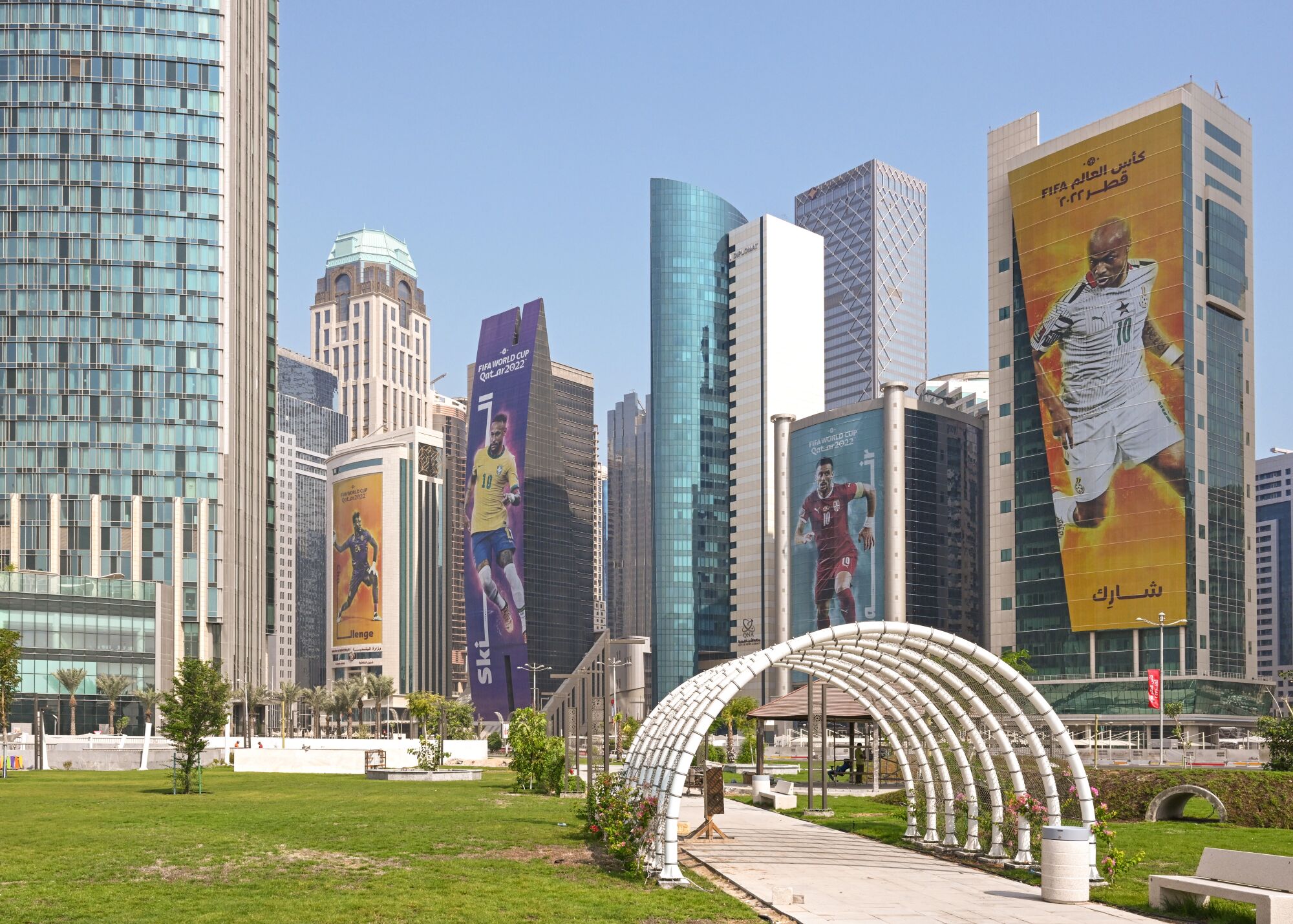 FIFA World Cup posters covering West Bay skyscrapers in Doha, Qatar.