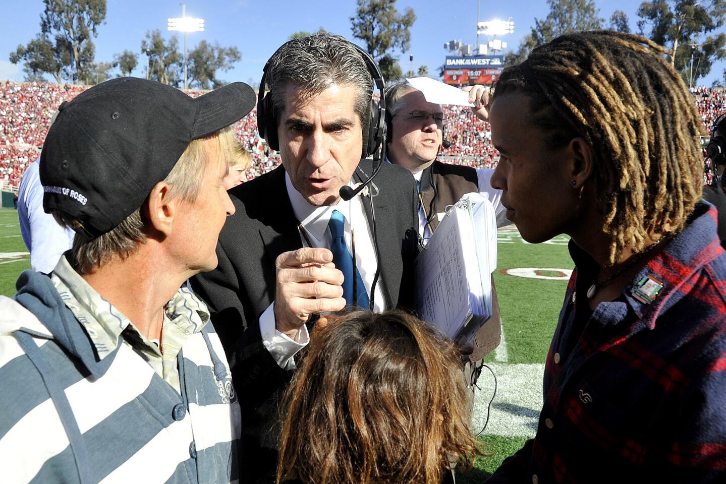 Game manager Ted Tompkins instructs friends of Jane Goodall about what they will be doing at the 99th Rose Bowl in Pasadena on Tuesday, January 1, 2013.