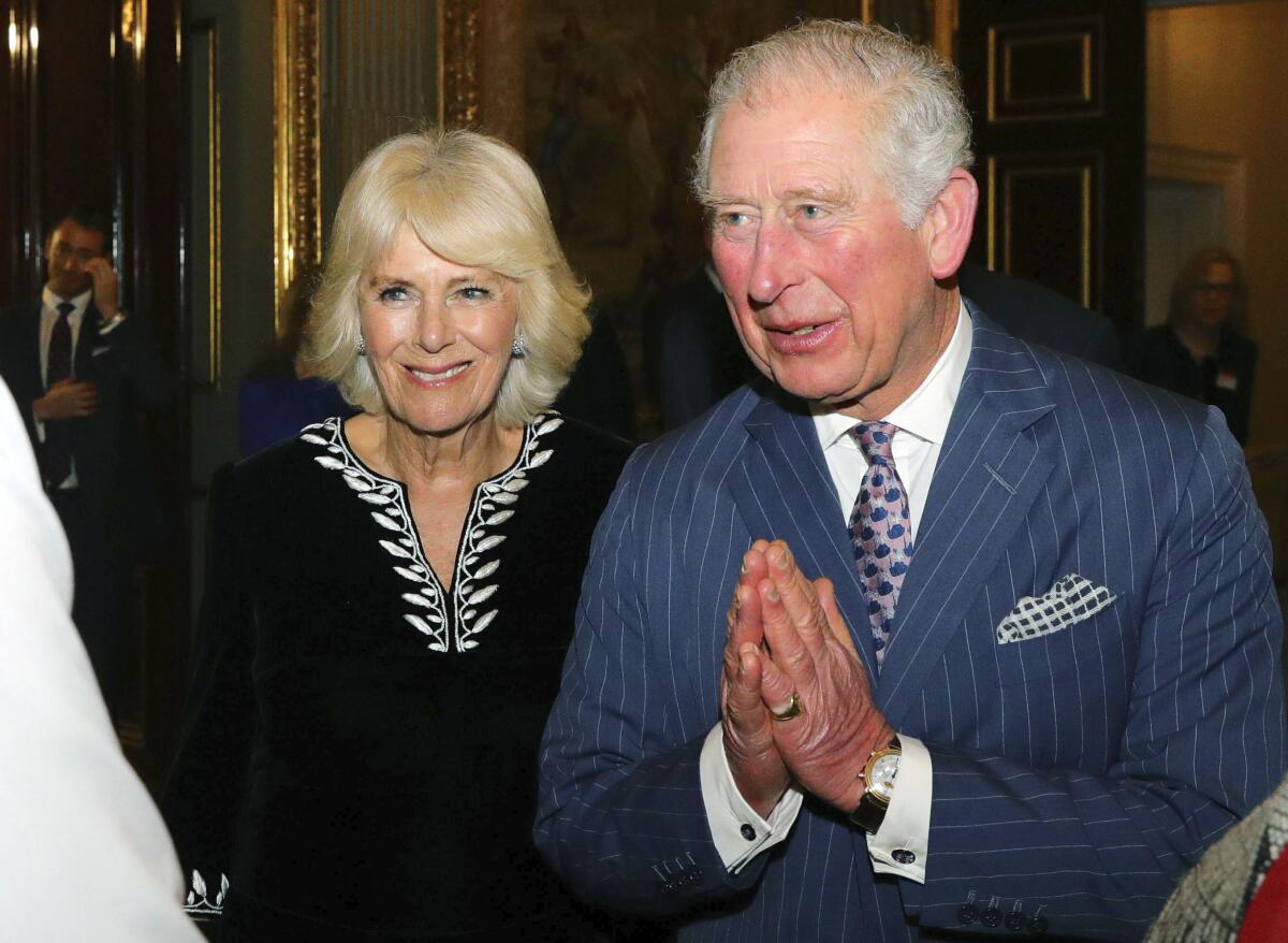 Britain's Prince Charles and Camilla, Duchess of Cornwall, attend a reception in London in March 2020.