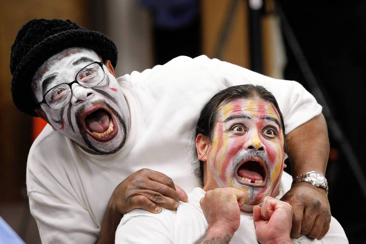 Charles, left, and Carlos act in a graduation performance at the California Rehabilitation Center in Norco. They had taken part in the eight-week Actors' Gang Prison Project.