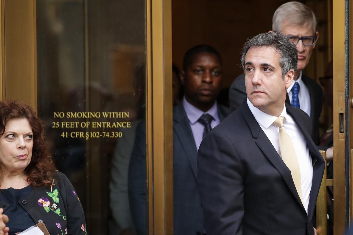 Michael Cohen exits federal court in New York City on Tuesday.