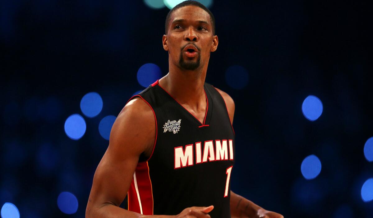 Heat forward Chris Bosh takes part in the Shooting Stars competition during the NBA All-Star weekend.