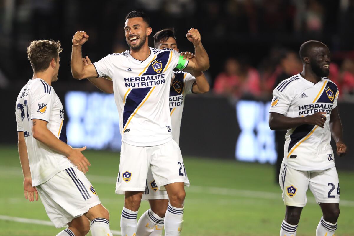 CARSON, CALIFORNIA - JULY 23: Giancarlo Gonzalez #21 is congratulated by Emil Cuello #27 and Ema Boateng #24 of Los Angeles Galaxy after defeating Tijuana in penalty kicks during the quarterfinal match of the 2019 Leagues Cup at Dignity Health Sports Park on July 23, 2019 in Carson, California. (Photo by Sean M. Haffey/Getty Images) ** OUTS - ELSENT, FPG, CM - OUTS * NM, PH, VA if sourced by CT, LA or MoD **