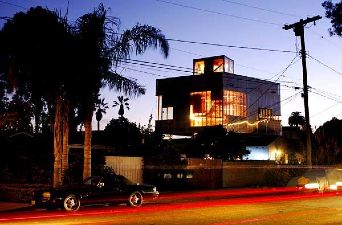 By Paul Young Robert Choeff and Krystyan Keck's home in Venice stands out. The residence looks like two houses stacked on top of each other, largely because it is. The bottom is a 1913 cottage, the top a translucent modernist box. One almost expects to see Dorothy inside this bit of Oz. "We definitely have more than our share of gawkers," Keck says. Some passersby find the style mash-up to be weird, but to others the house is a clever solution to a difficult problem: How do you take a small lot, double the size of your living space and still end up with a piece of interesting architecture? Though the husband and wife have worked together on projects in the past, this is their first collaboration as the Bureau of Architectural Affairs. Each decision they made was driven by pure practicality. The choice to float the new space over the original home, for instance, was driven by code. If they had built a new structure from the ground up, they would have been required to include a garage, which would have taken up precious space. "We also needed to keep the cost down," Keck says. "So that was a big factor in keeping the original house intact."