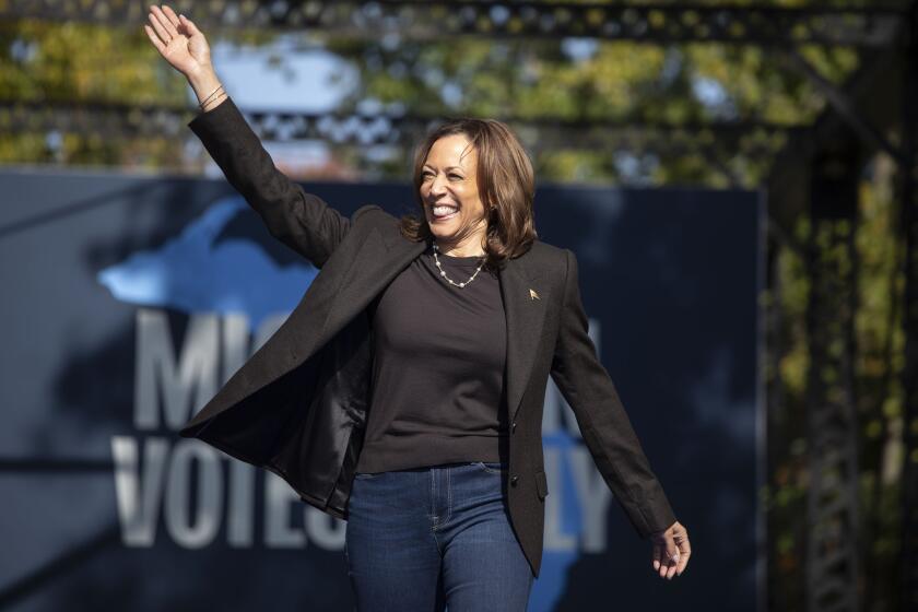 GRAND RAPIDS, MICHIGAN - OCTOBER 18: Democratic presidential nominee Vice President Kamala Harris walks out on stage before speaking at a campaign event on October 18, 2024 in Grand Rapids, Michigan. Harris will also be campaigning in Lansing, Oakland County, and Detroit over the next two days as Michigan is considered a key battleground state holding 14 electoral votes. (Photo by Bill Pugliano/Getty Images)