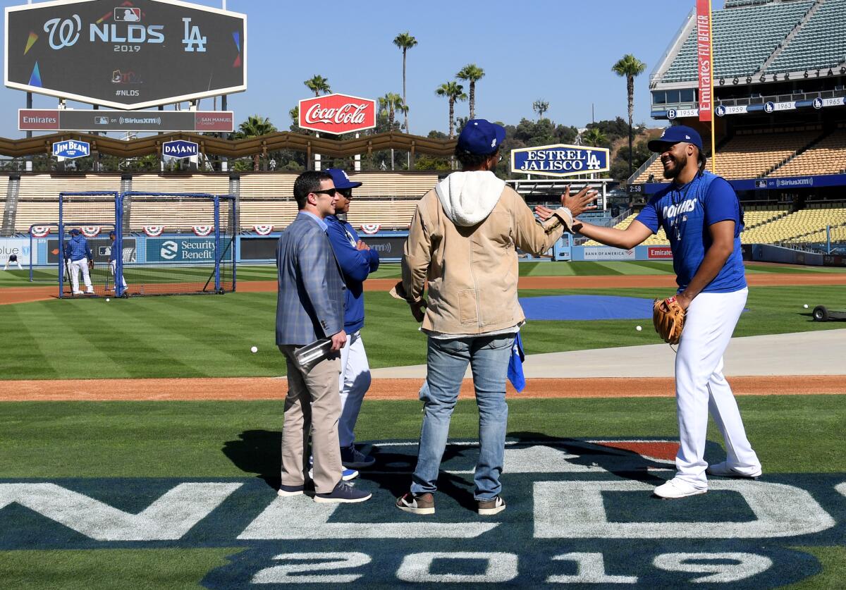 Dodgers closer Kenley Jansen greets former Dodgers outfielder Matt Kemp.