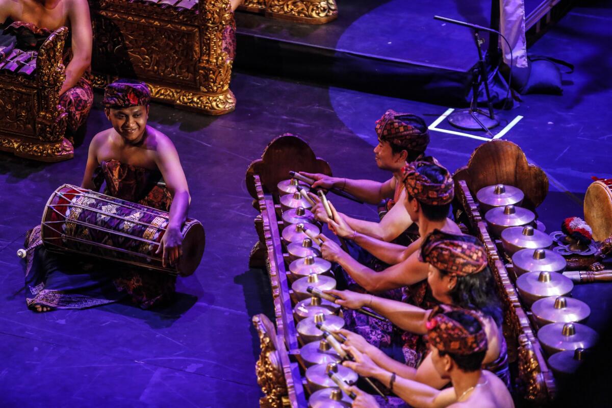 The gamelan orchestra's bells, gongs, flute and other instruments were played with precision.