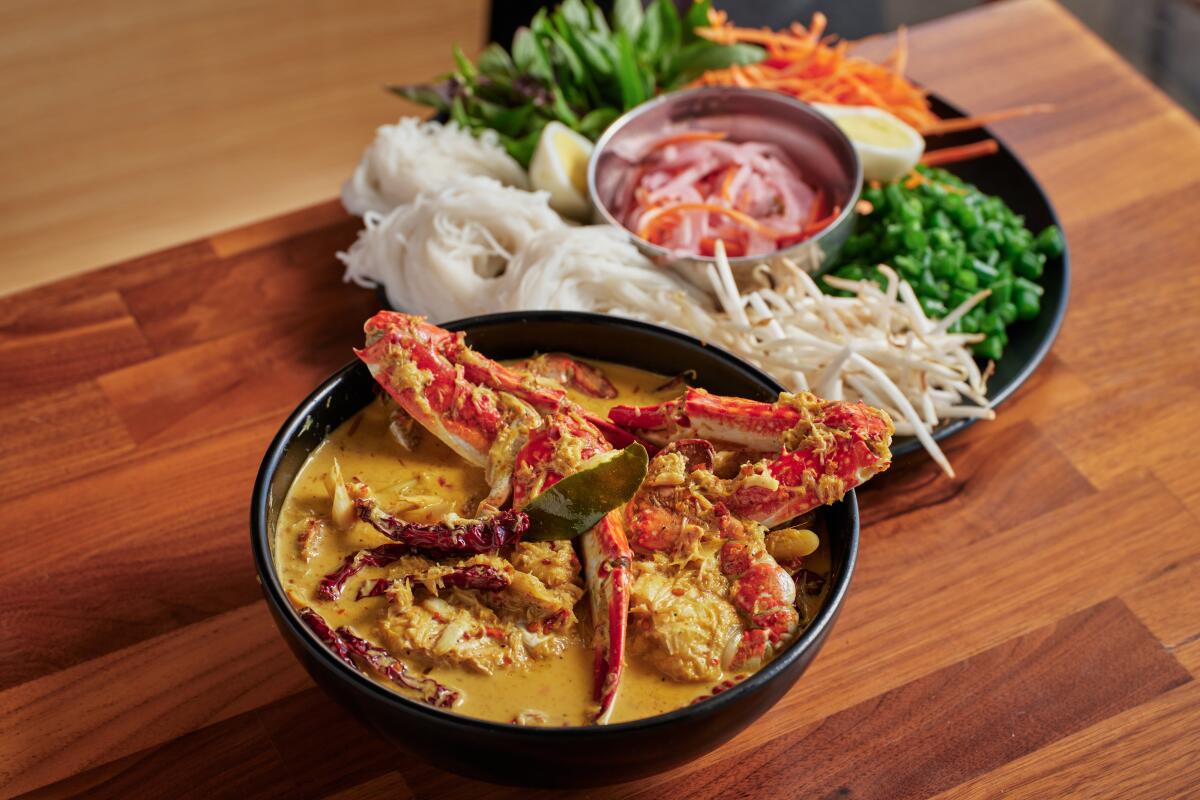 The crab curry with rice noodles and heaps of fresh toppings at Luv2Eat Thai Bistro