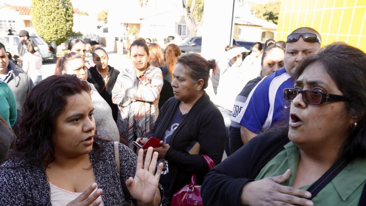 Concerned parents gather at Montara Avenue Elementary School in South Gate for a meeting with school officials Monday morning after it was announced that a third-grade teacher died of bacterial meningitis.