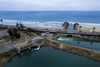 Carlsbad, CA - June 07: The area for the proposed new construction where the large filter screens are located and the discharge pond at the Carlsbad Desalination Plant on Tuesday, June 7, 2022 in Carlsbad, CA. (Nelvin C. Cepeda / The San Diego Union-Tribune)