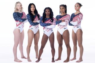 U.S. women's Olympic gymnastics team members show off custom leotards they can wear during the Paris Olympics.