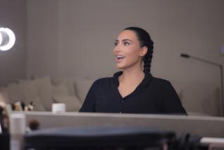 Kim Kardashian smiles