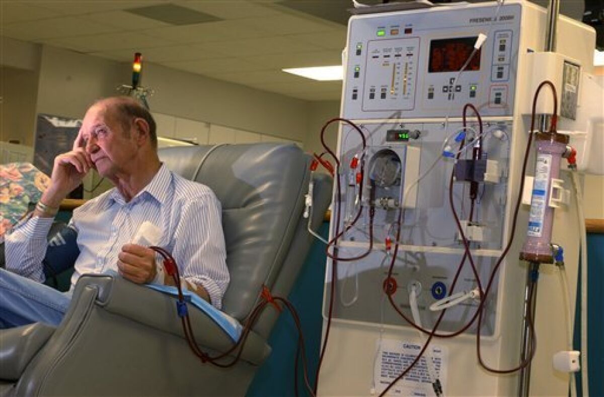 A patient sits during one of his three weekly sessions where he receives his kidney dialysis treatments.