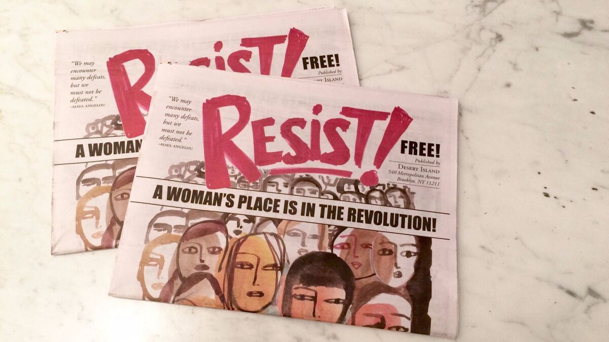 Copies of the women's art comic "Resist!" at the Hammer Museum.