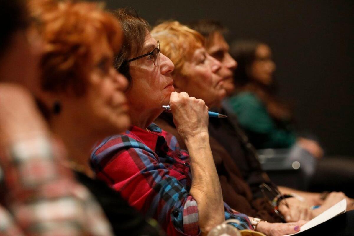 Diane Schoolsky of Tarzana listens during a community meeting in West Hollywood in early June where county officials discussed potential locations for new voting centers.