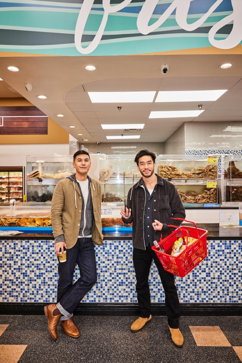 Byron Wu and Justin Chien, holding a red shopping basket, at 99 Ranch Market.