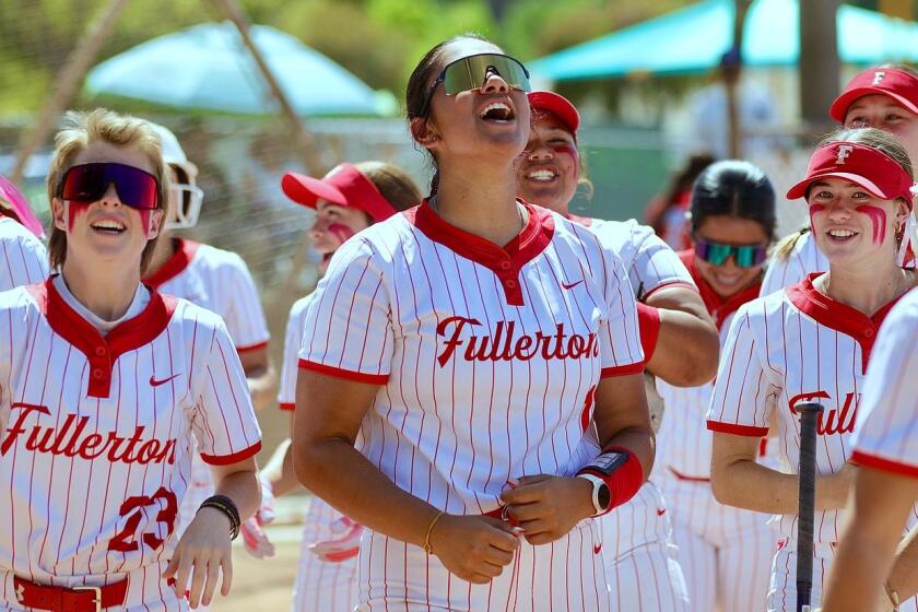 Ava Flores (middle) has been a big contributor for Fullerton softball.
