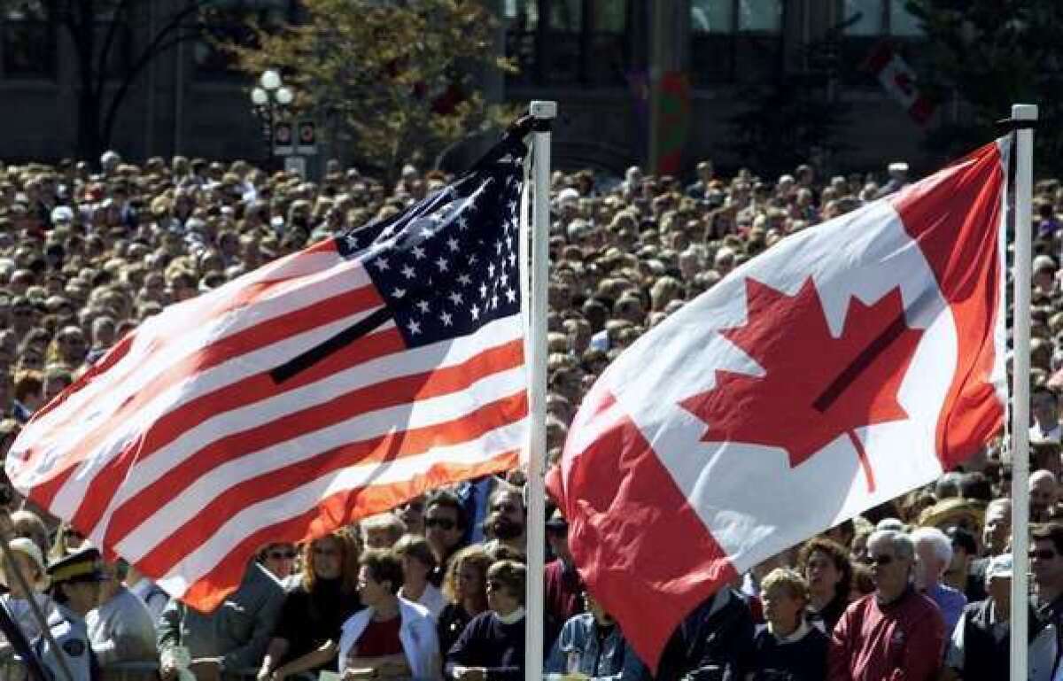 U.S. and Canadian flags: GOP Sen. Ted Cruz of Texas will pledge allegiance to only one.