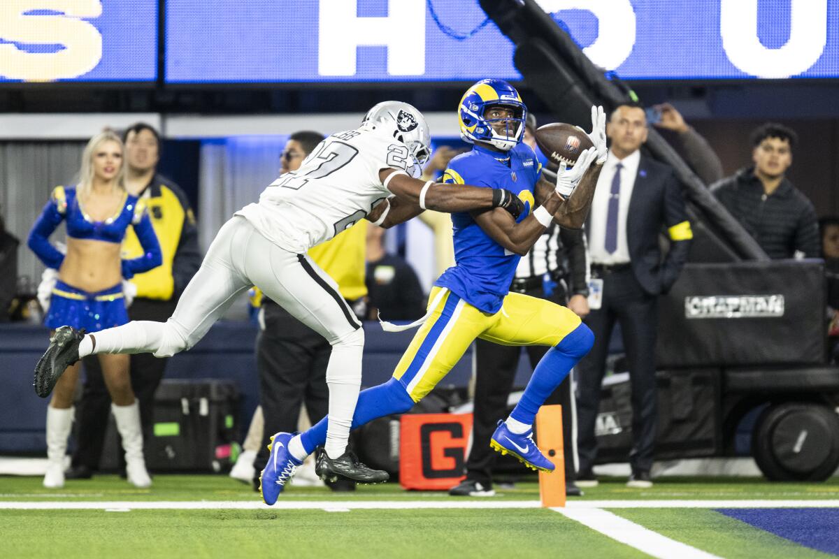 Rams wide receiver Van Jefferson catches a touchdown pass while defended by Raiders cornerback Troy Pride Jr.