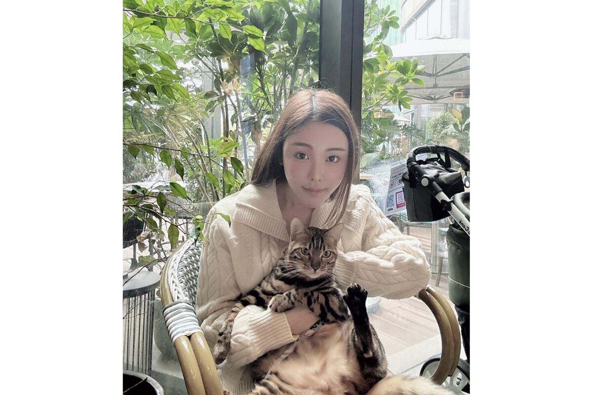Hong Kong model Abby Choi holding a cat