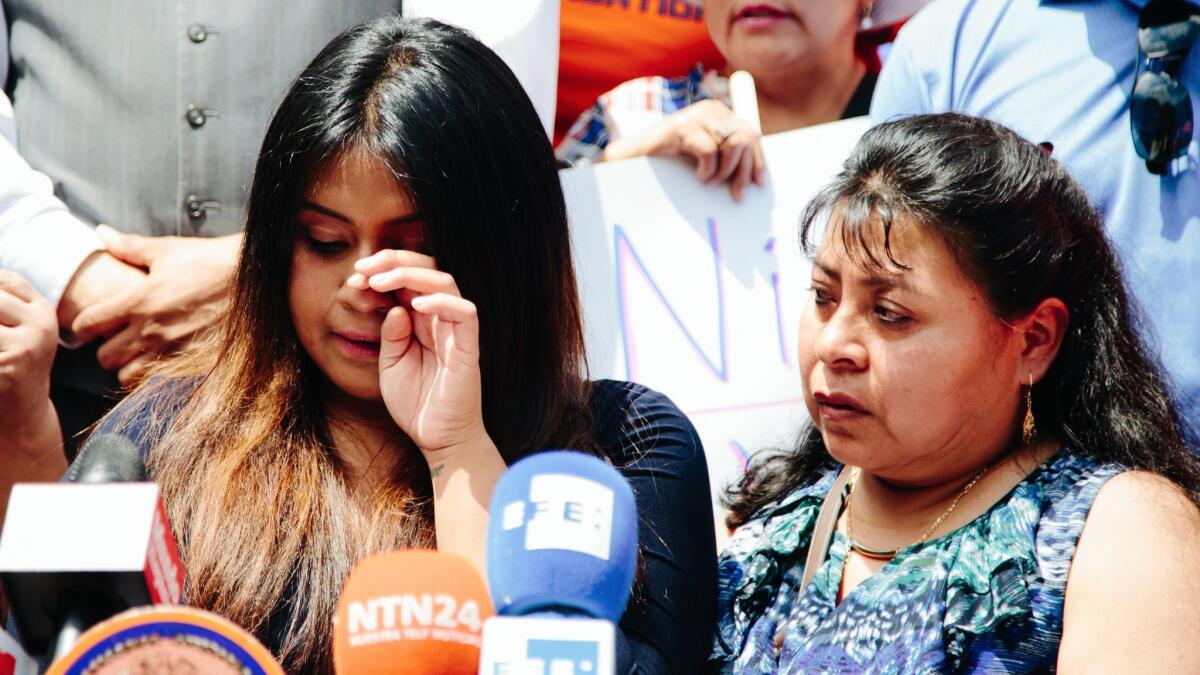 Martin Martinez's wife and daughter address the media and supporters outside the Immigration and Customs Enforcement Building in New York on June 21. Martinez had been following ICE's instructions by checking in annually but is now being deported.