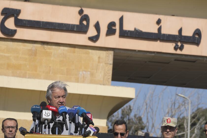 United Nations Secretary General Antonio Guterres speaks after his visit to the Rafah border crossing between Egypt and the Gaza Strip, Saturday, March 23, 2024. Arabic reads, "Rafah border crossing". (AP Photo/Amr Nabil)