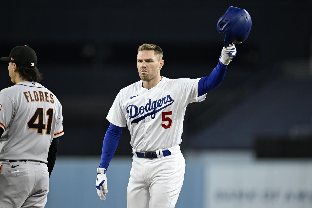 Freddie Freeman acknowledges the fans after recording his 200th hit of the season against the San Francisco Giants.