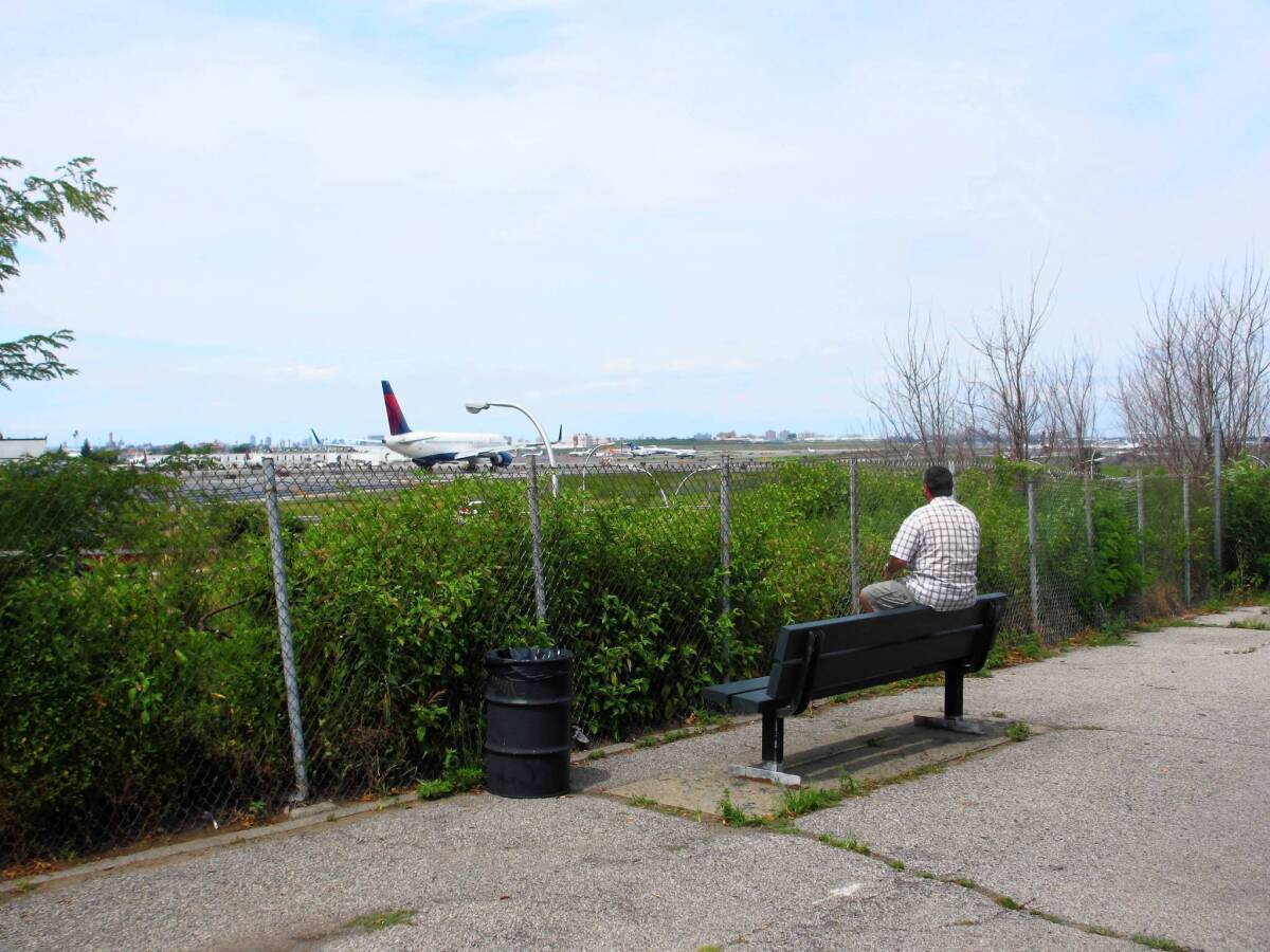 Plane spotter Douglas Thompson watches jets from the aptly named Planeview Park outside LaGuardia Airport in New York.