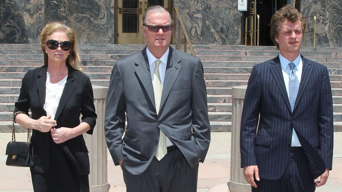 Conrad Hilton, right, leaves court with his parents, Kathy and Richard Hilton, in 2015 after his sentencing for causing a disturbance aboard an international flight from London to Los Angeles.