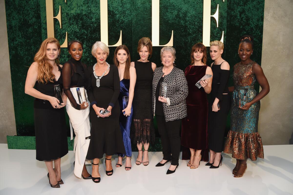 Elle editor-in-chief Robbie Myers, center, is surrounded by honorees Amy Adams, from left, Aja Naomi King, Helen Mirren, Anna Kendrick, Kathy Bates, Felicity Jones, Kristen Stewart and Lupita Nyong'o at the Elle Women in Hollywood Awards.