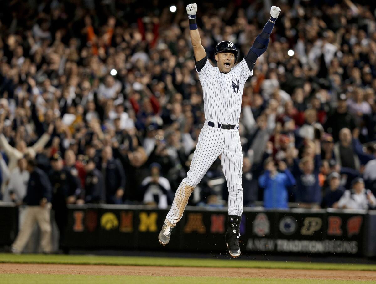 FILE - In this Sept. 25, 2014, file photo, New York Yankees' Derek Jeter jumps after hitting the game-winning single against the Baltimore Orioles in the ninth inning of a baseball game, in New York. The Yankees won 6-5. It was Jeter's last home game of his career at Yankee Stadium. The Baseball Hall of Fame will induct Jeter on Wednesday, Sept. 8, 2021. (AP Photo/Julie Jacobson, File)