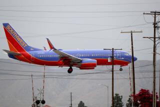 A Southwest Airlines plane crosses Vineland Ave., in North Hollywood, at it lands at the Hollywood Burbank Airport, on Thursday, July 25, 2019.