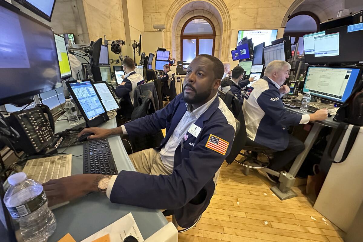Traders work on the New York Stock Exchange floor in New York City.