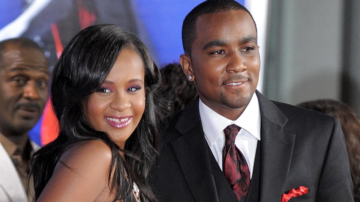 Bobbi Kristina Brown, shown with Nick Gordon in 2012, remains in a medically induced coma after undergoing a tracheotomy. She has been hospitalized since Jan. 31.