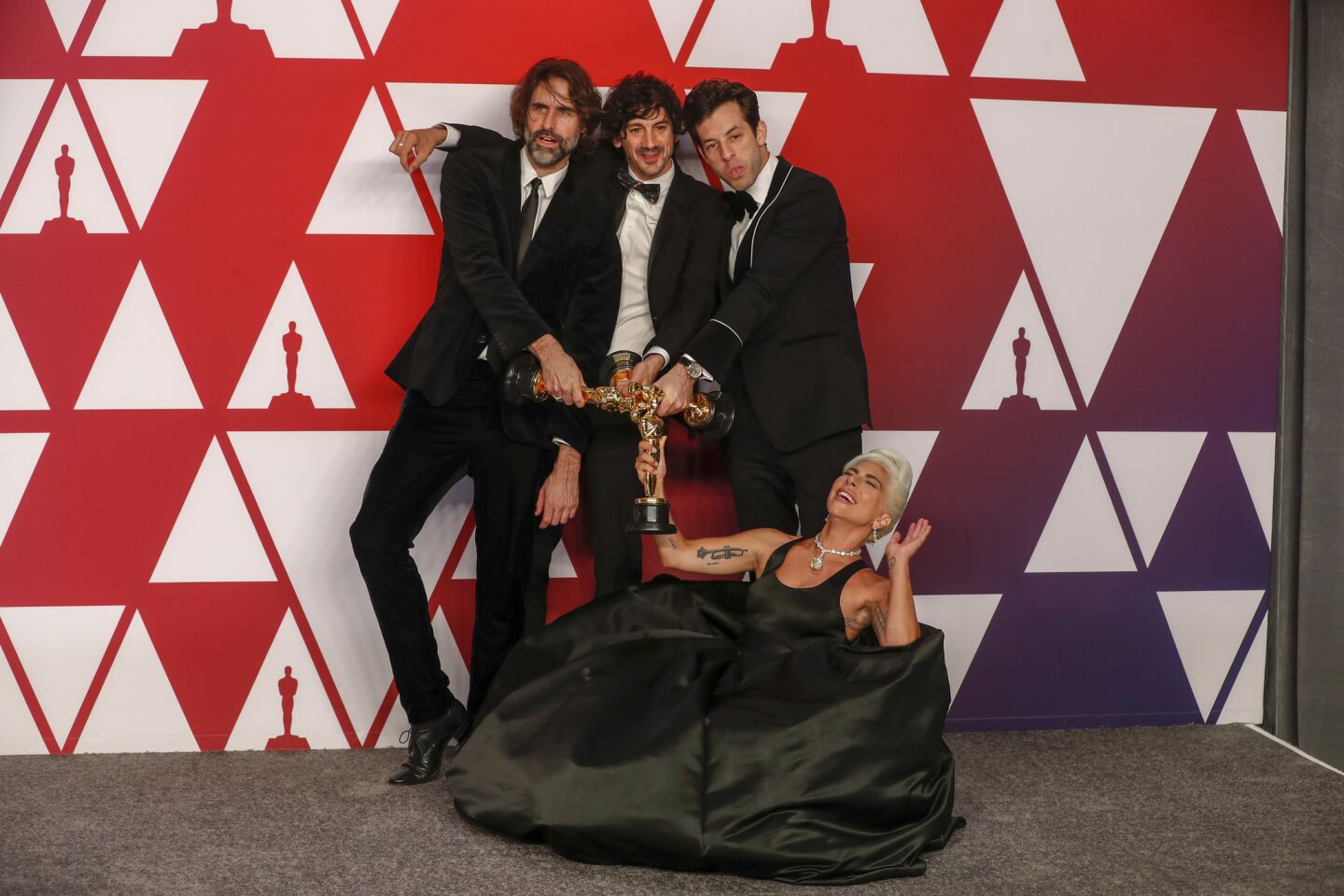 Andrew Wyatt, left, Anthony Rossomando, Lady Gaga and Mark Ronson, winners of the original song Oscar for "Shallow."