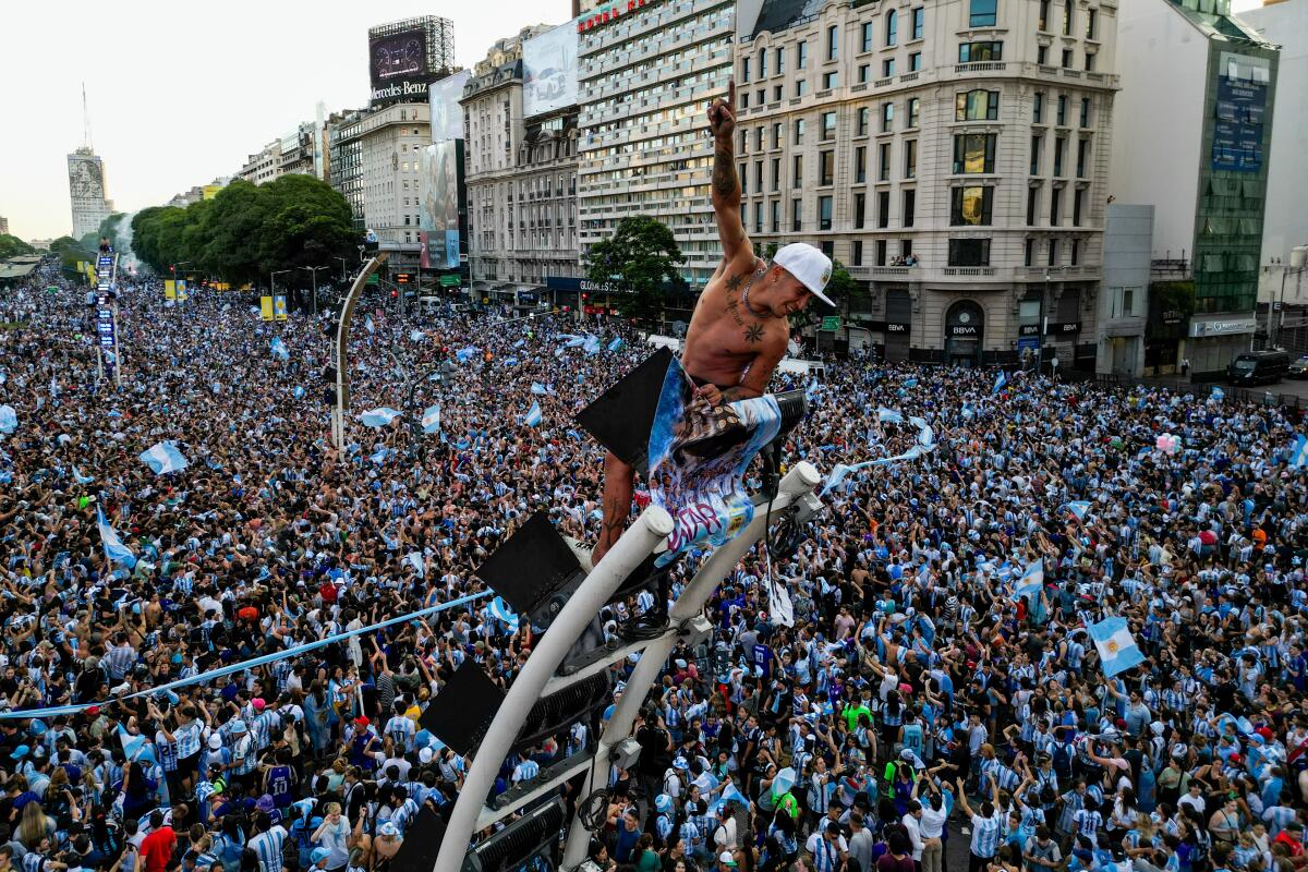Argentine fans celebrate at the Obelisk in Buenos Aires 
