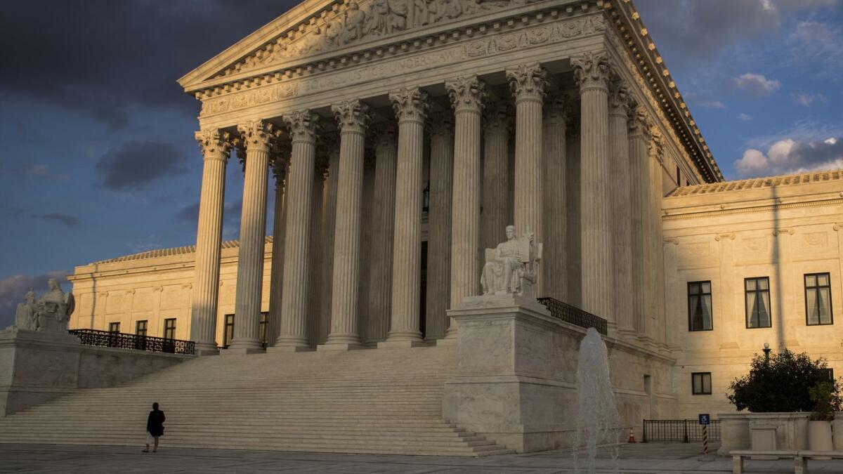 In this Oct. 10, 2017, photo, the Supreme Court in Washington is seen at sunset.