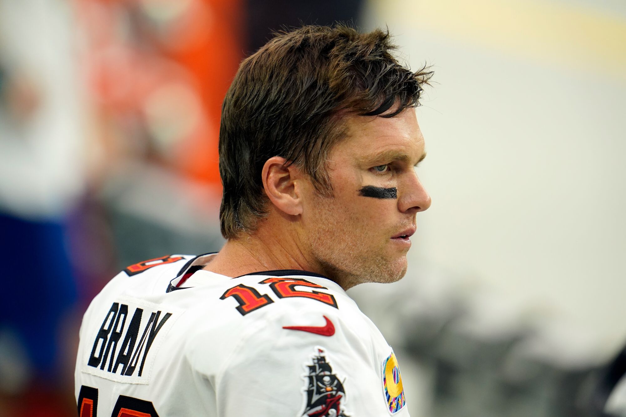 Tom Brady stands on the sideline during a game against the Las Vegas Raiders on Oct. 25.